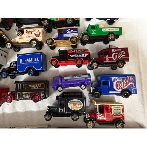 1150 - A collection of toy vehicles to include a boxed Disney Burago 1/18 scale beetle, Lledo vehicles, Mat... 