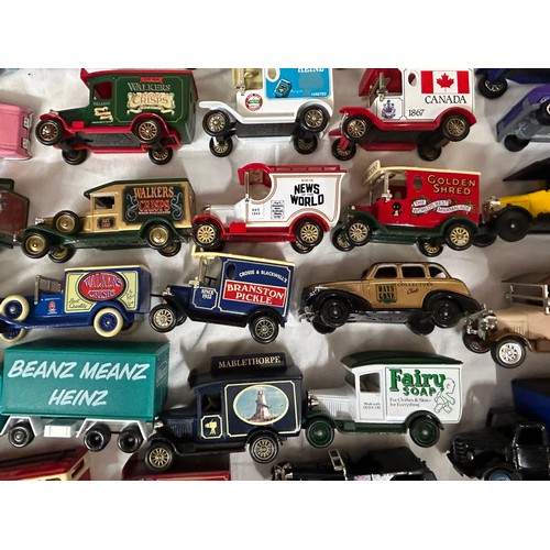 1150 - A collection of toy vehicles to include a boxed Disney Burago 1/18 scale beetle, Lledo vehicles, Mat... 