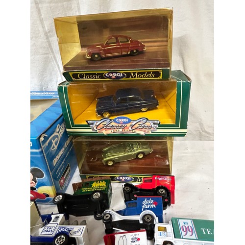 1150 - A collection of toy vehicles to include a boxed Disney Burago 1/18 scale beetle, Lledo vehicles, Mat... 