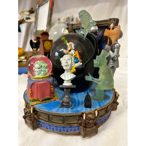 A collection of seven Disney snow globes to include 4 working musical ...