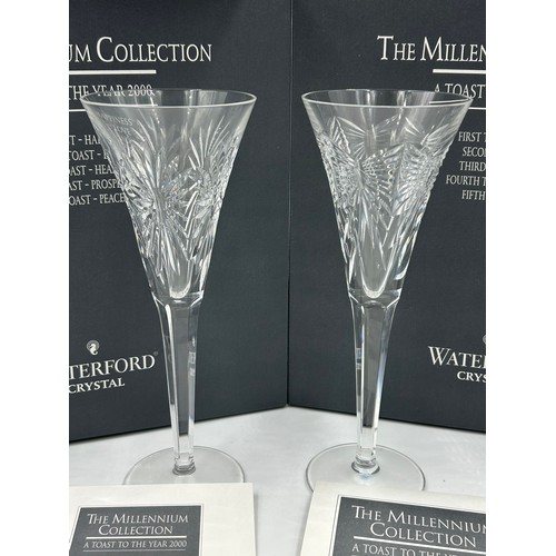 286 - Two boxed pairs of Waterford crystal champagne flutes from 'The Millennium 2000 Collection', 23.5cm ... 