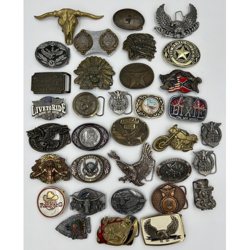 422 - Collection of 34 belt buckles, mainly in brass with Native American designs, eagles, motorbikes etc.