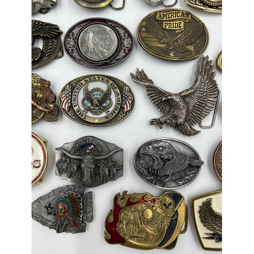 422 - Collection of 34 belt buckles, mainly in brass with Native American designs, eagles, motorbikes etc.