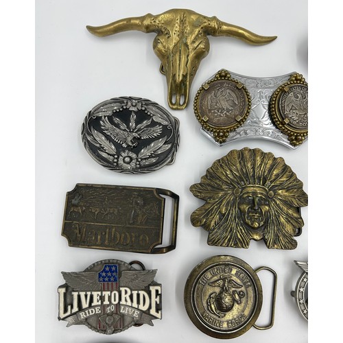 422 - Collection of 34 belt buckles, mainly in brass with Native American designs, eagles, motorbikes etc.