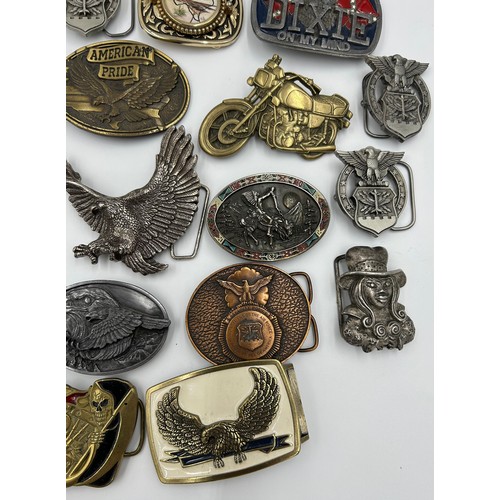 422 - Collection of 34 belt buckles, mainly in brass with Native American designs, eagles, motorbikes etc.