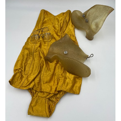 717 - A 1950’s ladies strapless bathing costume with zip to back and ruched sides together with a pair of ... 