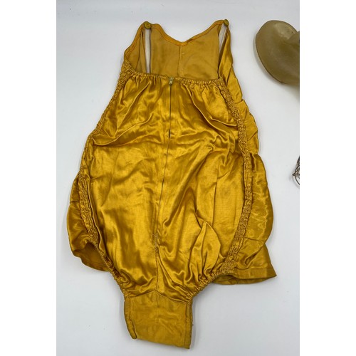 717 - A 1950’s ladies strapless bathing costume with zip to back and ruched sides together with a pair of ... 