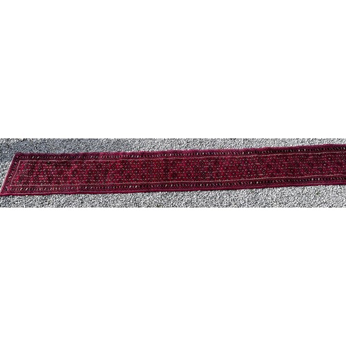 1101 - A very long hand made Iranian wool runner from Liberty of London 780cm x 75.5cm at widest.