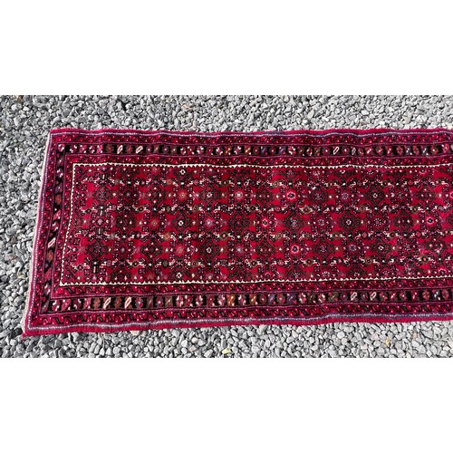 1101 - A very long hand made Iranian wool runner from Liberty of London 780cm x 75.5cm at widest.