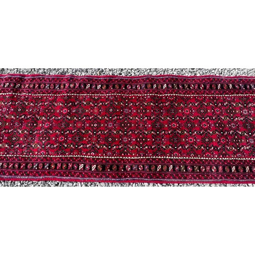 1101 - A very long hand made Iranian wool runner from Liberty of London 780cm x 75.5cm at widest.