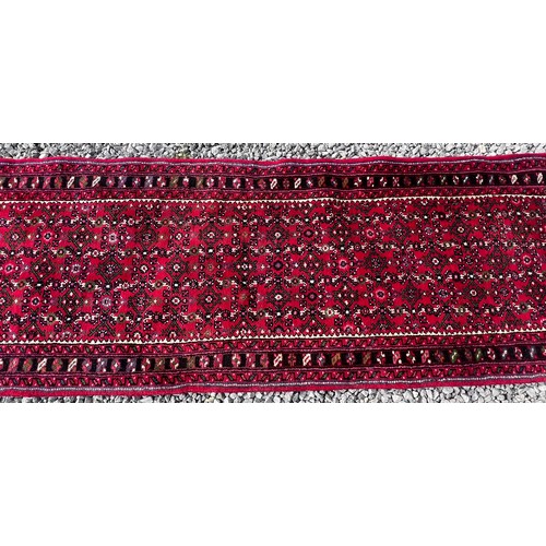 1101 - A very long hand made Iranian wool runner from Liberty of London 780cm x 75.5cm at widest.