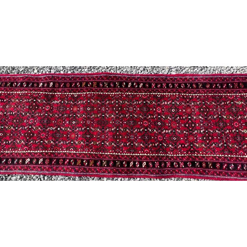 1101 - A very long hand made Iranian wool runner from Liberty of London 780cm x 75.5cm at widest.