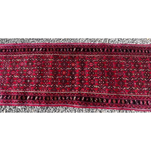 1101 - A very long hand made Iranian wool runner from Liberty of London 780cm x 75.5cm at widest.