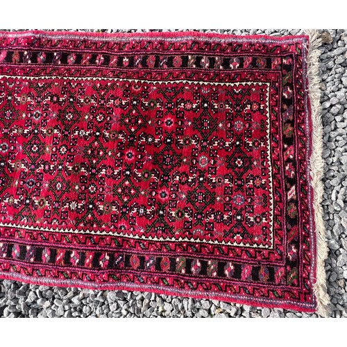 1101 - A very long hand made Iranian wool runner from Liberty of London 780cm x 75.5cm at widest.