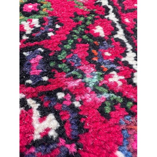 1101 - A very long hand made Iranian wool runner from Liberty of London 780cm x 75.5cm at widest.