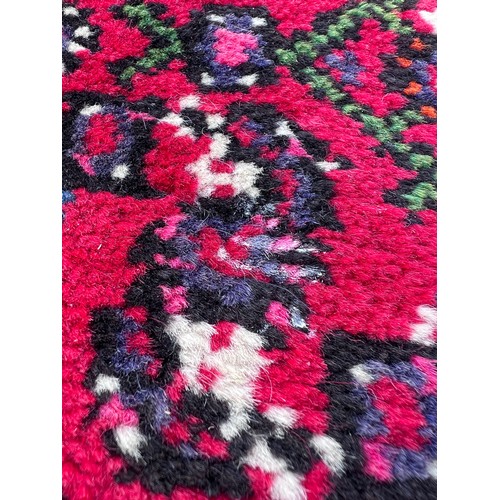 1101 - A very long hand made Iranian wool runner from Liberty of London 780cm x 75.5cm at widest.