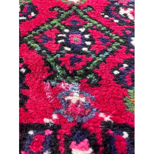 1101 - A very long hand made Iranian wool runner from Liberty of London 780cm x 75.5cm at widest.