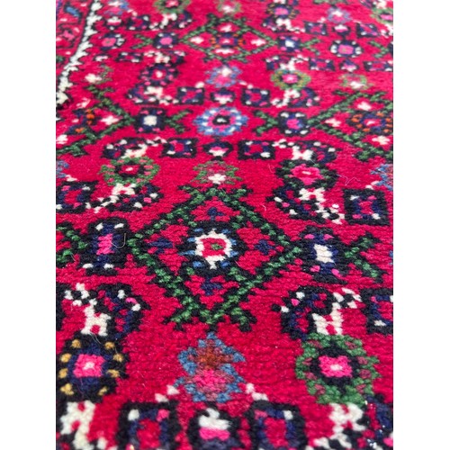 1101 - A very long hand made Iranian wool runner from Liberty of London 780cm x 75.5cm at widest.