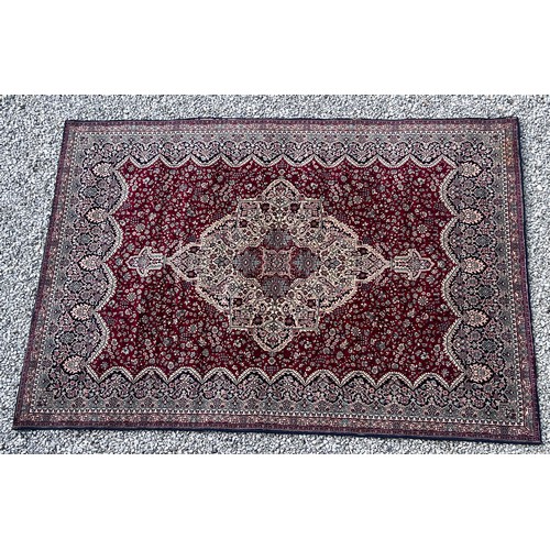 1102 - A good quality red ground wool carpet 315cm x 223cm.