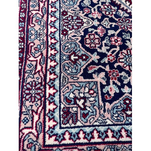 1102 - A good quality red ground wool carpet 315cm x 223cm.