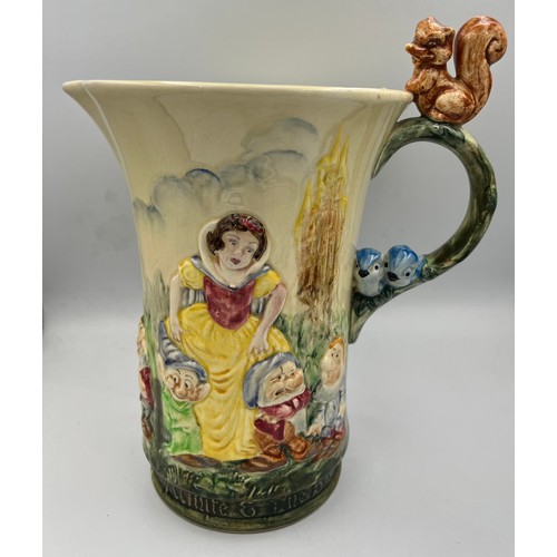 186 - A Wadeheath musical jug, Snow White and the seven dwarfs. 22cm h.