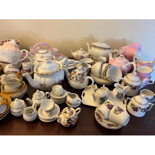 192 - A quantity of late 19thC and early 20thC children’s and doll’s tea services, ribbon plates etc.