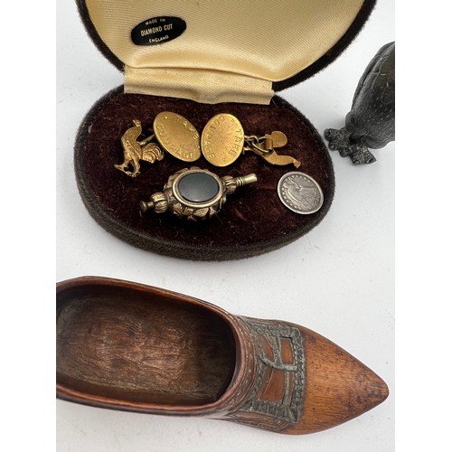 1305 - A miscellaneous lot to include ‘Take Courage’ cufflinks, watch key, early 19thC treen shoe, 1850 hal... 