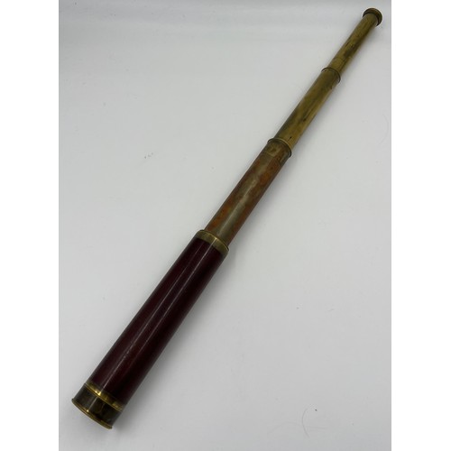 1307 - A G Adams London brass and mahogany telescope. 75cm l extended.