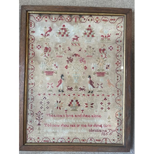 715 - A wool cross stitch sampler by Christiana Tur 1855. 59cm x 46cm.