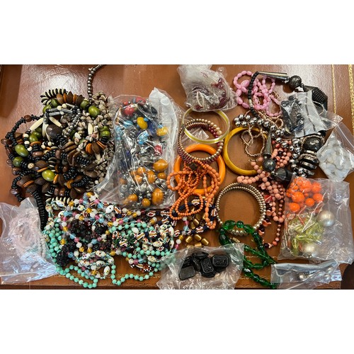 432 - A quantity of vintage beads and bangles.