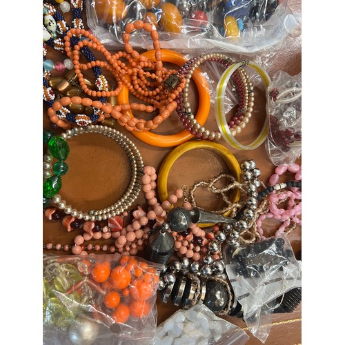 432 - A quantity of vintage beads and bangles.