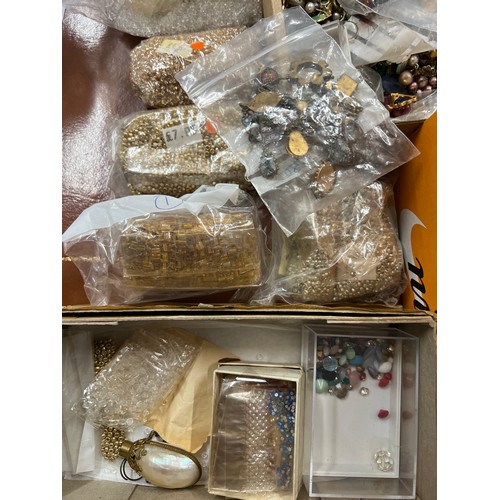 431 - A quantity of mainly small loose beads and fittings etc in two boxes.