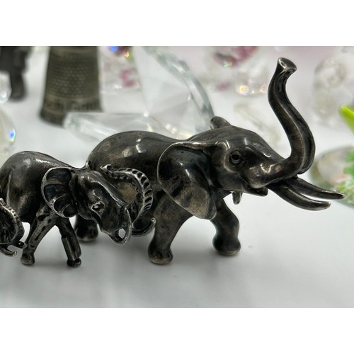 297 - Collection of miniature glass animals and other items to include elephants, Swarovski etc.