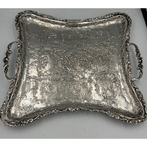 915 - A continental .800 white metal twin handled tray raised on four feet. Weight 350gm.