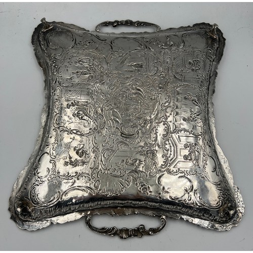 915 - A continental .800 white metal twin handled tray raised on four feet. Weight 350gm.