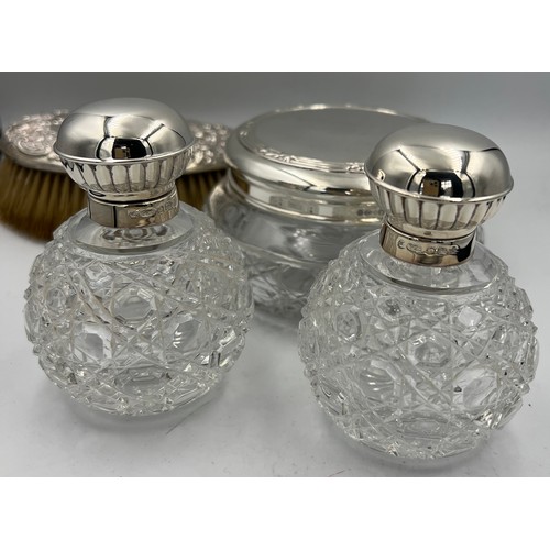 917 - Four silver topped glass dressing table jars. Sheffield 2000, maker Carr’s of Sheffield Ltd and a Ch... 