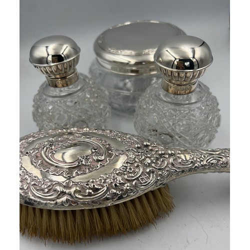 917 - Four silver topped glass dressing table jars. Sheffield 2000, maker Carr’s of Sheffield Ltd and a Ch... 