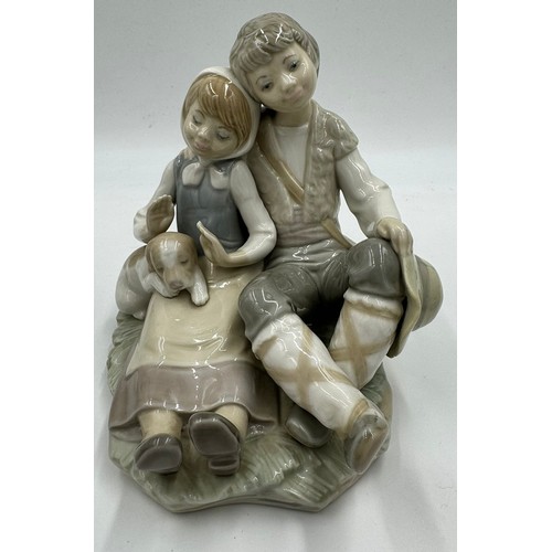 151 - Three Lladro figurines to include 'At the seaside', 'Washing up girl' 23cm h, and 'Friendship.