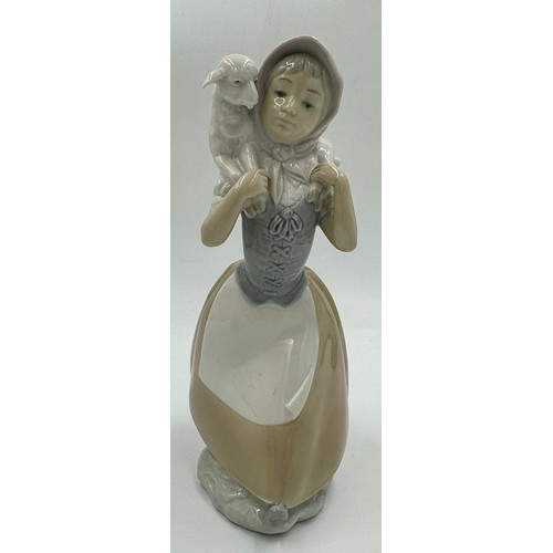 150 - Three Lladro figurines to include Girl with umbrella and geese 4510; Lady with umbrella and dog 4761... 