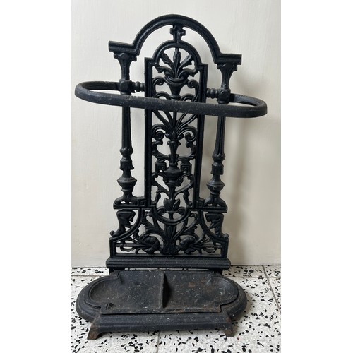 1316 - A cast iron stick stand. 51cm h x 33cm w.