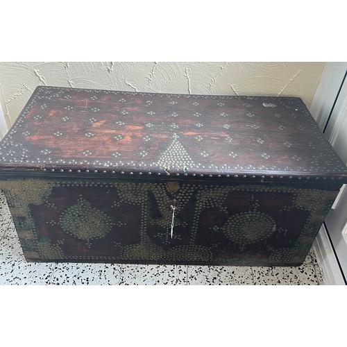 23 - A 19thC Middle Eastern brass studded blanket box with interior candle box. 103cm w x 47cm d x 48cm h... 