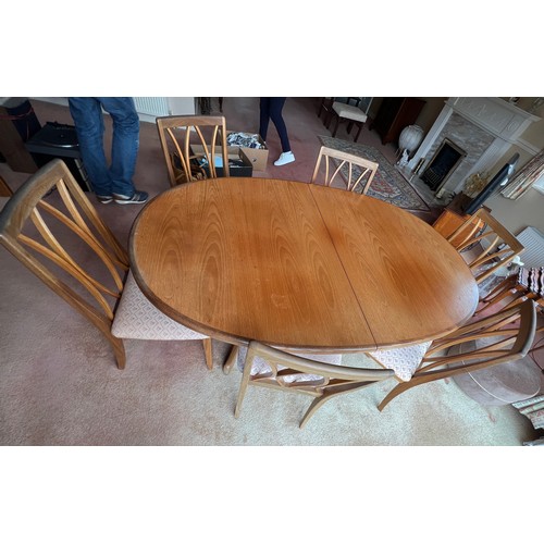 28 - A G Plan extending dining table and 6 dining chairs, circa 1977. Extended 107cm w x 209cm l. Closed ... 