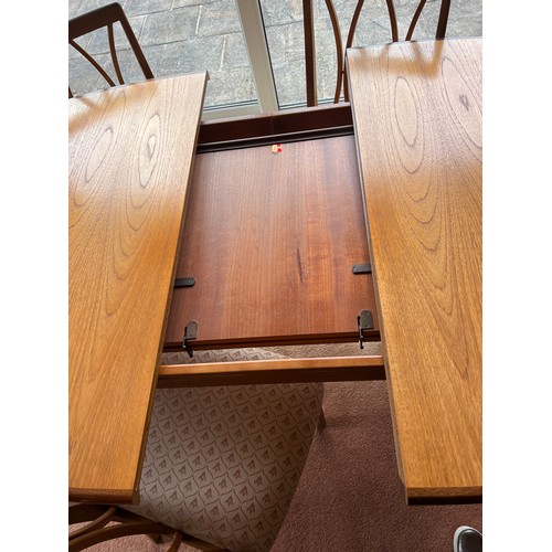 28 - A G Plan extending dining table and 6 dining chairs, circa 1977. Extended 107cm w x 209cm l. Closed ... 