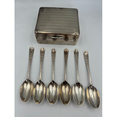 906 - A set of six silver spoons, London 1921 together with a silver cigarette box.  Weight of spoons 65.1... 