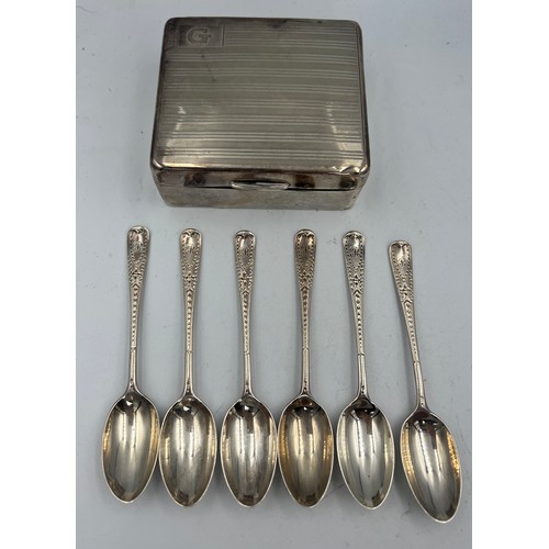 906 - A set of six silver spoons, London 1921 together with a silver cigarette box.  Weight of spoons 65.1... 