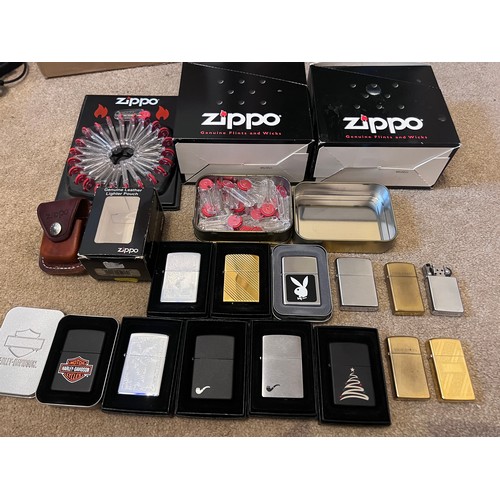 1322 - A large collection of mostly boxed Zippo lighters to include Harley Davidson, Bunny, older brass lig... 