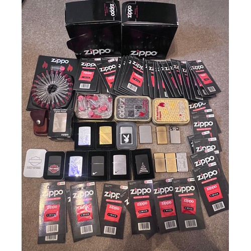 1322 - A large collection of mostly boxed Zippo lighters to include Harley Davidson, Bunny, older brass lig... 