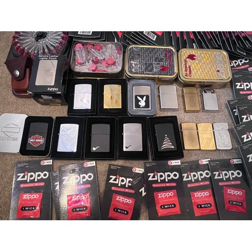 1322 - A large collection of mostly boxed Zippo lighters to include Harley Davidson, Bunny, older brass lig... 