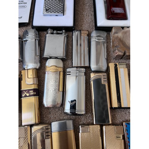 1323 - A large collection of lighters to include Ronson, Hadson, Jack Daniels etc.