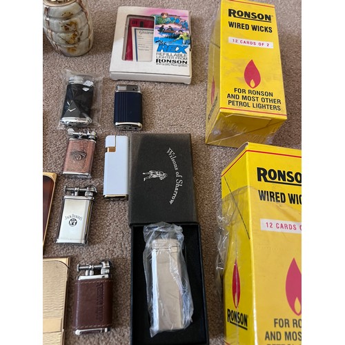 1323 - A large collection of lighters to include Ronson, Hadson, Jack Daniels etc.